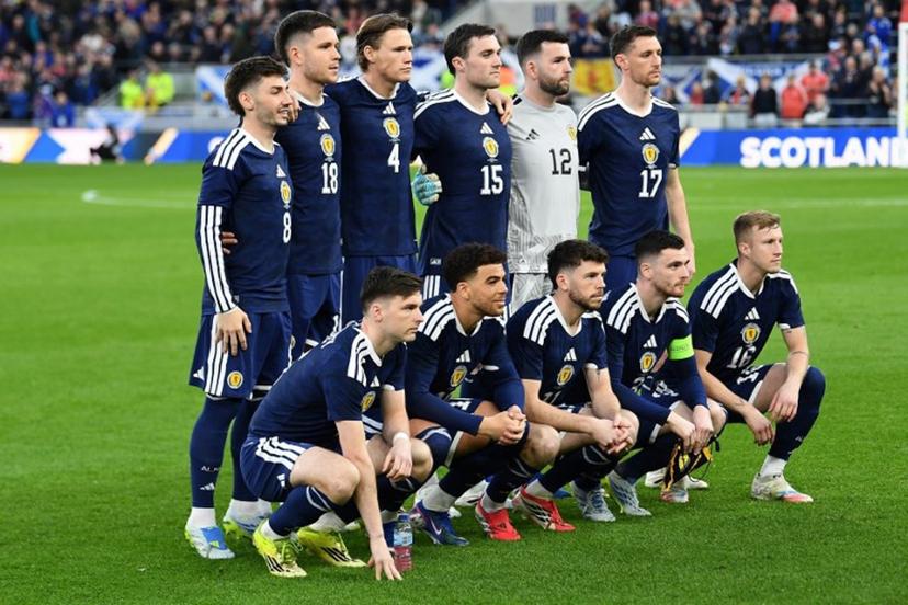 (Back row L-R) Scotland's midfielder #08 Billy Gilmour, Scotland's striker #18 George Hirst, Scotland's midfielder #04 Scott McTominay, Scotland's defender #15 John Souttar, Scotland's goalkeeper #12 Liam Kelly and Scotland's defender Dominic Hyam, (Front row L-R) Scotland's defender #06 Kieran Tierney, Scotland's forward #10 Che Adams, Scotland's forward #11 Ryan Christie, Scotland's defender #03 Andrew Robertson and Scotland's midfielder #16 Ross McCrorie pose for a team photo ahead of the friendly international football match between Scotland and Ivory Coast at the Hill Dickinson Stadium in Liverpool, north west England on March 31, 2026.    PETER POWELL / AFP