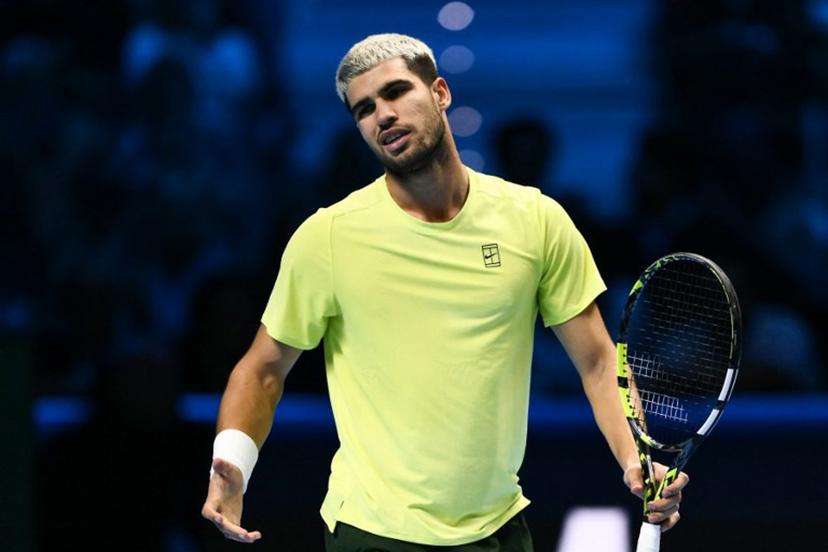 Spain's Carlos Alcaraz reacts during the men's single final match against Italy's Jannik Sinner at the ATP Finals tennis tournament, in Turin, on November 16, 2025.  Marco BERTORELLO / AFP