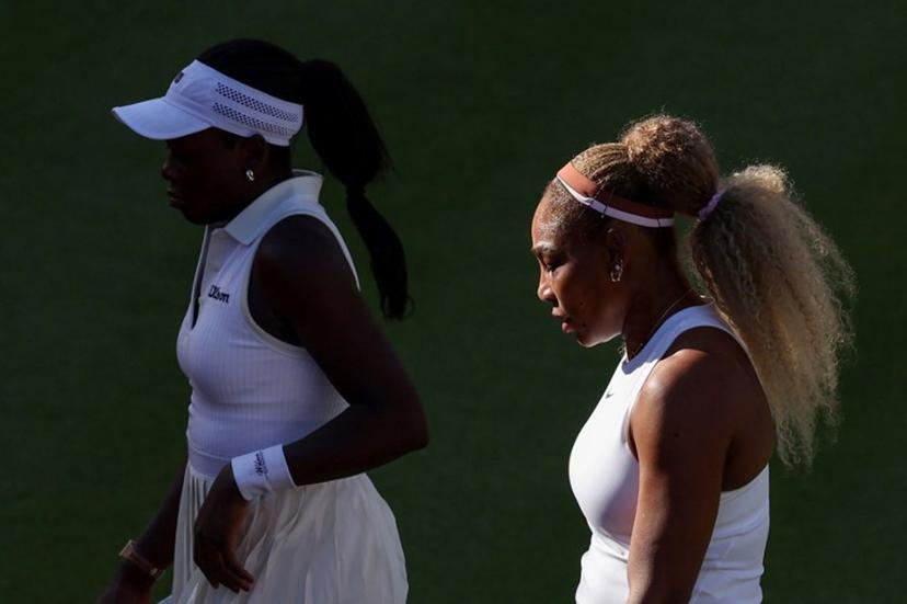 US player Serena Williams (R) walks with Canada's Victoria Mboko (L) while playing against US player Nicole Melichar-Martinez and New Zealand's Erin Routliffe during their round of 16, doubles match at the HSBC WTA tennis Championships at Queen's Club in west London on June 9, 2026.  Adrian Dennis / AFP