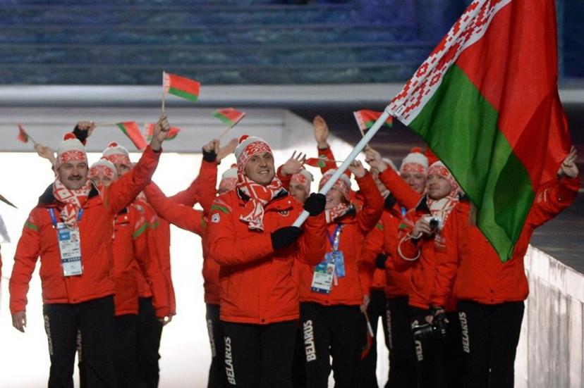 Belarus' flag bearer, freestyle skier Aleksei Grishin, leads his national delegation during the Opening Ceremony of the 2014 Sochi Winter Olympics at the Fisht Olympic Stadium on February 7, 2014 in Sochi. AFP PHOTO / ANDREJ ISAKOVIC  Andrej ISAKOVIC / AFP