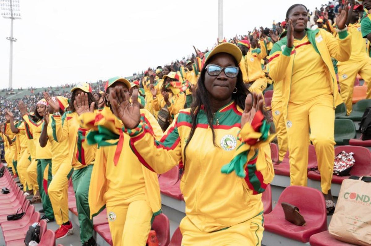 Lions of Senegal's supporters cheer during the Senegal's national football team last training session prior to the start of the 2025 Africa Cup of Nations hosted by Morocco, at the Leopaul Sedar Senghor stadium, in Dakar on December 18, 2025.  SEYLLOU / AFP