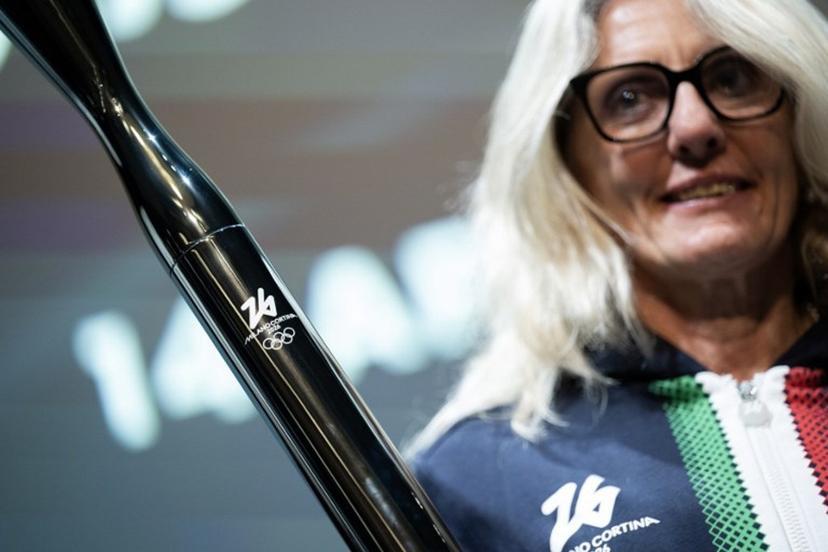 Former cross-country Italian athlete Stefania Belmondo poses during the unveiling of the torches for the Milano Cortina 2026 winter olympic and paralympic games in Milan on April 14, 2025.   MARCO BERTORELLO / AFP