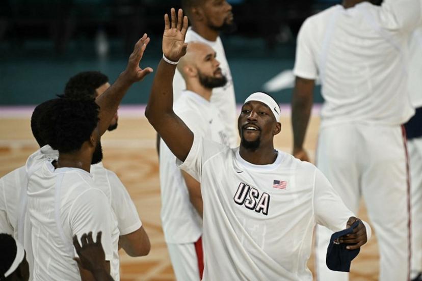 USA's #13 Bam Adebayo high fives teammates before the men's Gold Medal basketball match between France and USA during the Paris 2024 Olympic Games at the Bercy  Arena in Paris on August 10, 2024.  Paul ELLIS / AFP