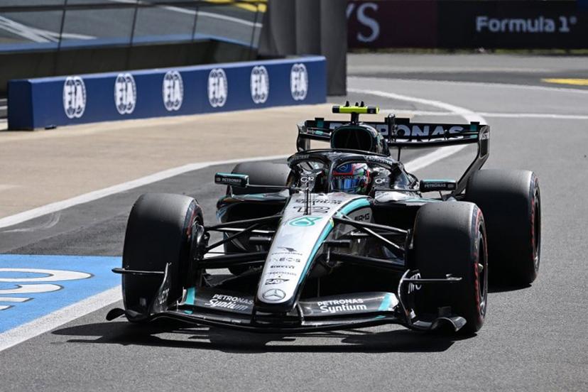 Mercedes' Italian driver Kimi Antonelli drives down pit lane during the qualifying session ahead of the Formula One British Grand Prix at the Silverstone motor racing circuit in Silverstone, central England, on July 4, 2026.  PETER POWELL / POOL / AFP