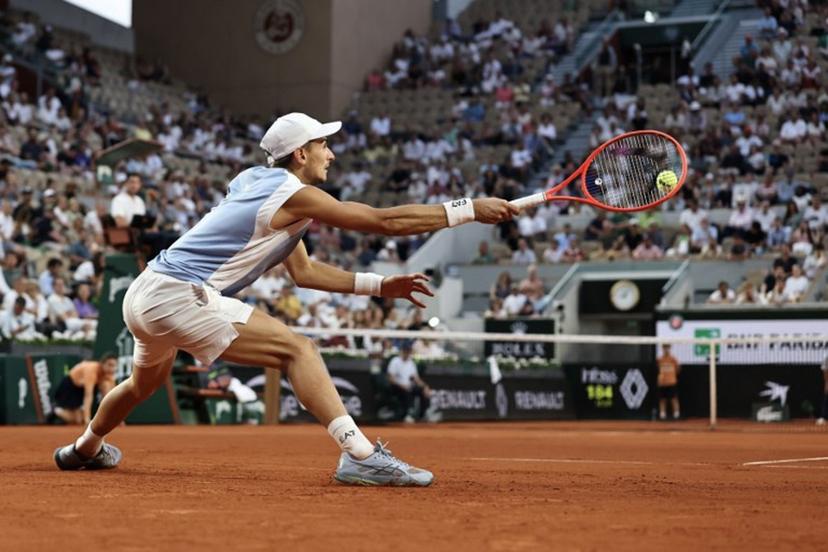 Italy's Matteo Arnaldi plays a forehand return to US Frances Tiafoe during their men's singles match on day 9 of the French Open tennis tournament on Court Suzanne-Lenglen at the Roland-Garros Complex in Paris on June 1, 2026.  Anne-Christine POUJOULAT / AFP