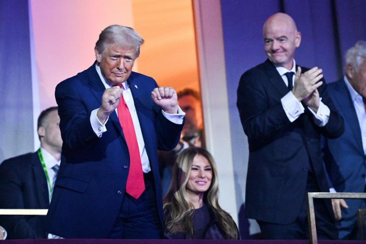 US President Donald Trump dances as US Musical Group The Village People perform the song "YMCA" during the draw for the 2026 FIFA Football World Cup taking place in the US, Canada and Mexico, at the Kennedy Center, in Washington, DC, on December 5, 2025.  Mandel NGAN / POOL / AFP