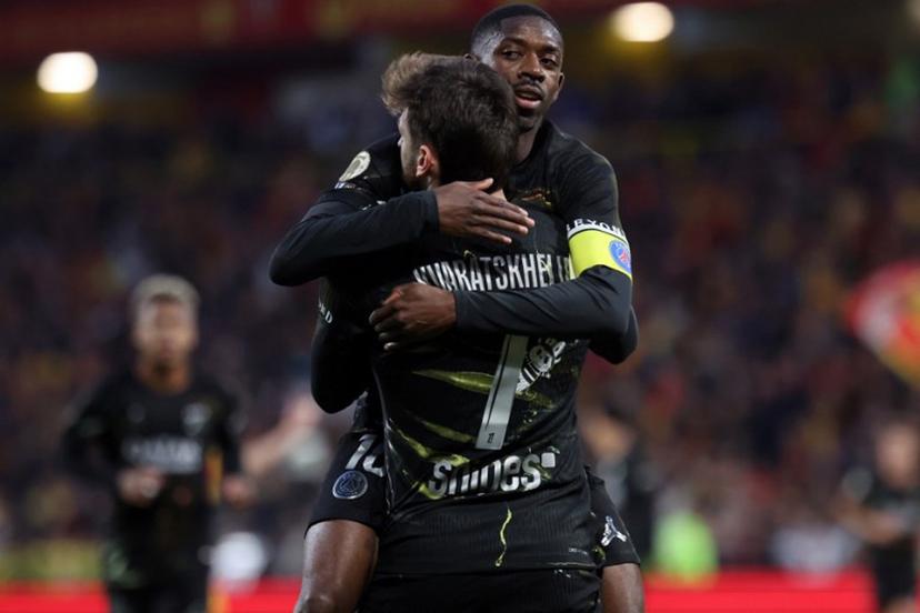 Paris Saint-Germain's Georgian forward #07 Khvicha Kvaratskhelia (front) is congratulated by Paris Saint-Germain's French forward #10 Ousmane Dembele after scoring a goal during the French L1 football match between RC Lens and Paris Saint-Germain (PSG) at the Stade Bollaert-Delelis stadium in Lens on May 13, 2026.  Francois LO PRESTI / AFP