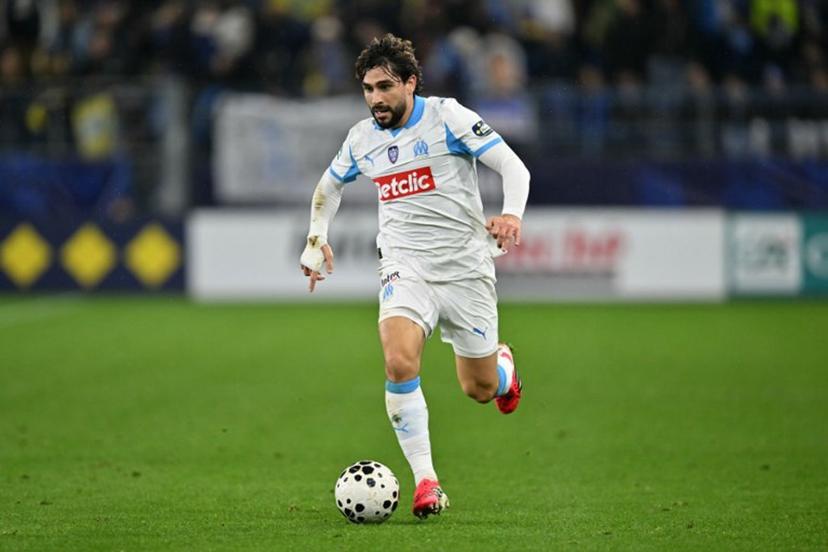 Marseille's French forward #15 Neal Maupay runs with the ball during the French Cup round of 32 football match between FC Bayeux and Olympique de Marseille (OM) at the Michel-d'Ornano Stadium in Caen on January 13, 2026.  LOU BENOIST / AFP