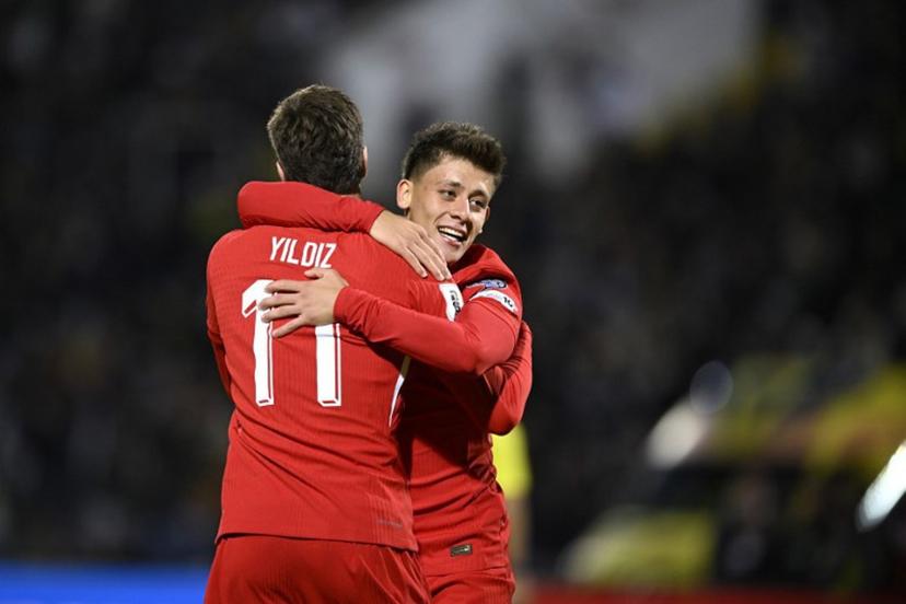 Turkey's forward #11 Kenan Yildiz (L) celebrates with Turkey's midfielder #08 Arda Guler (R) after scoring a goal during the FIFA World Cup 2026 Group E European qualification football match between Bulgaria and Turkey at the Vasil Levski National Stadium in Sofia, on October 11, 2025.  Nikolay DOYCHINOV / AFP