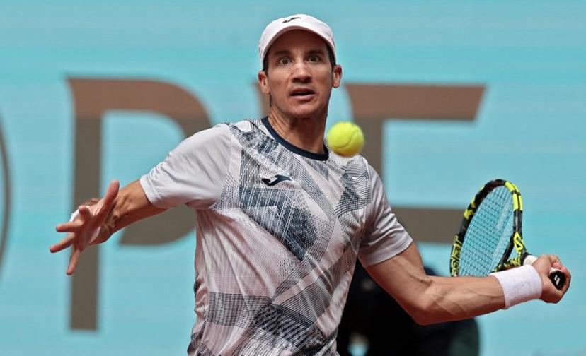 Argentina's Facundo Bagnis returns the ball to Russia's Andrey Rublev during the 2024 ATP Tour Madrid Open tennis tournament singles match at Caja Magica in Madrid on April 26, 2024.  Thomas COEX / AFP