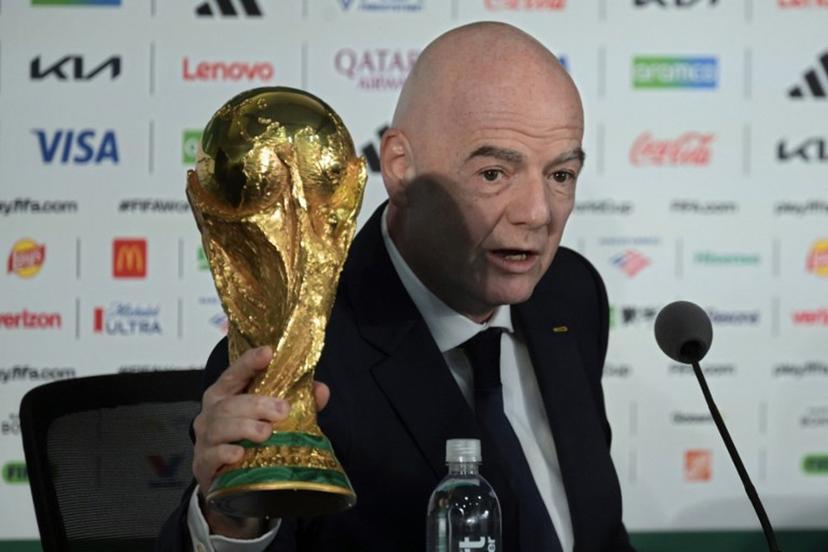 Gianni Infantino holds the World Cup trophy during a press conference on the eve of the opening match of the 2026 World Cup football tournament at Mexico city stadium in Mexico City on June 10, 2026.  Alfredo ESTRELLA / AFP