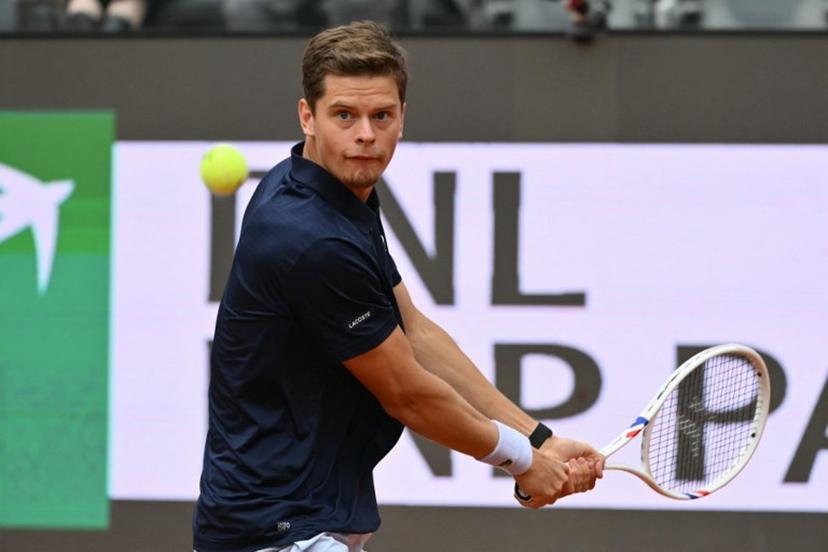 Belgium's Alexander Blockx hits a return to Germany's Alexander Zverev during their men's singles match at the WTA Rome Open tennis tournament at Foro Italico in Rome on May 10, 2026.   Alberto PIZZOLI / AFP