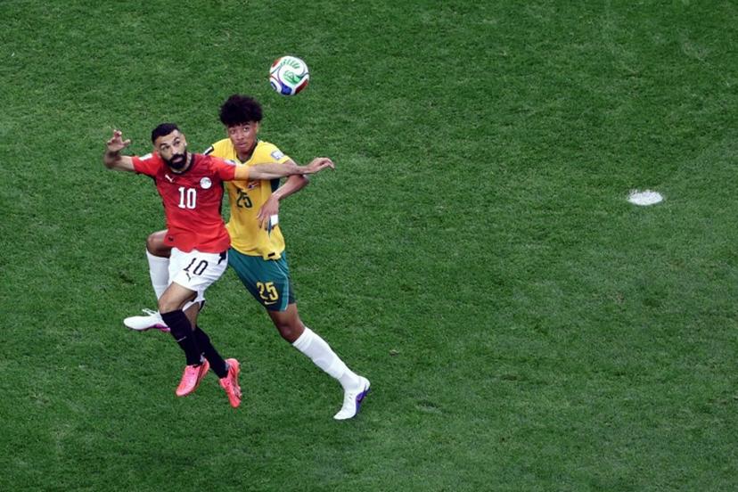 Australia's defender #25 Lucas Herrington (R) and Egypt's forward #10 Mohamed Salah jump for the ball  during the 2026 World Cup round of 32 football match between Australia and Egypt at the Dallas Stadium in Arlington on July 3, 2026.   Aric Becker / AFP