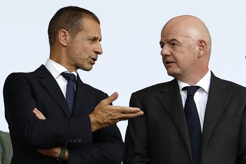 UEFA president Aleksander Ceferin (L) speaks with Fifa president Gianni Infantino before the start of the UEFA Euro 2024 round of 16 football match between Switzerland and Italy at the Olympiastadion Berlin in Berlin on June 29, 2024.  Odd ANDERSEN / AFP