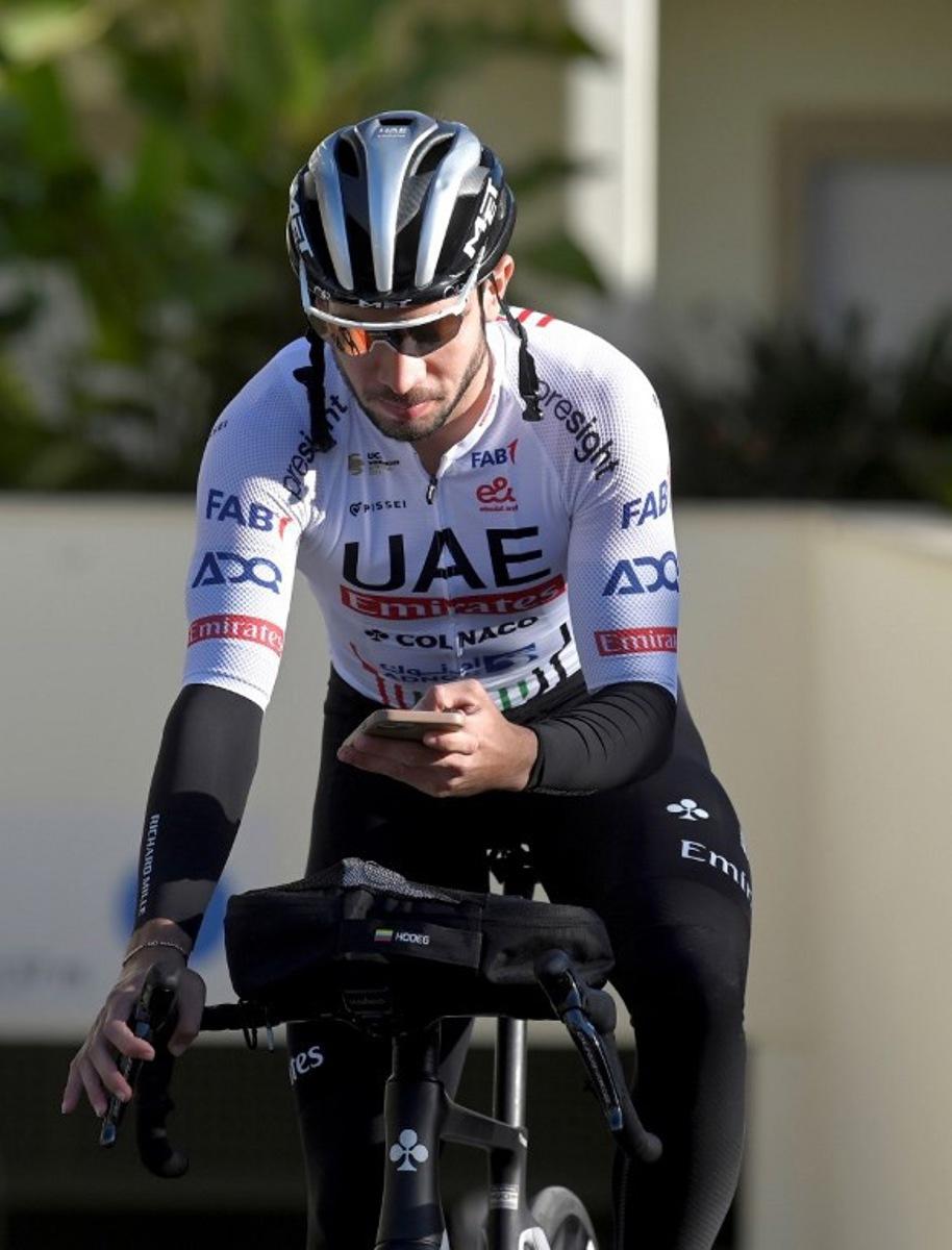 UAE-Team Emirates team member Sebastian Molano of Colombia prepares to attend a training session at La Nucia, near Alicante, eastern Spain on December 18, 2023.  JOSE JORDAN / AFP
