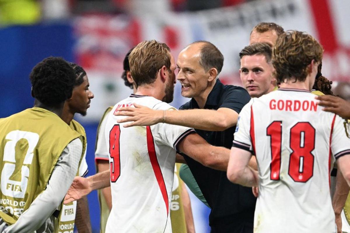 England's forward #09 Harry Kane celebrates with England's German head coach Thomas Tuchel after winning the 2026 World Cup round of 32 match football between England and the Democratic Republic of Congo at the Atlanta Stadium in Atlanta on July 1, 2026.   ROBERTO SCHMIDT / AFP