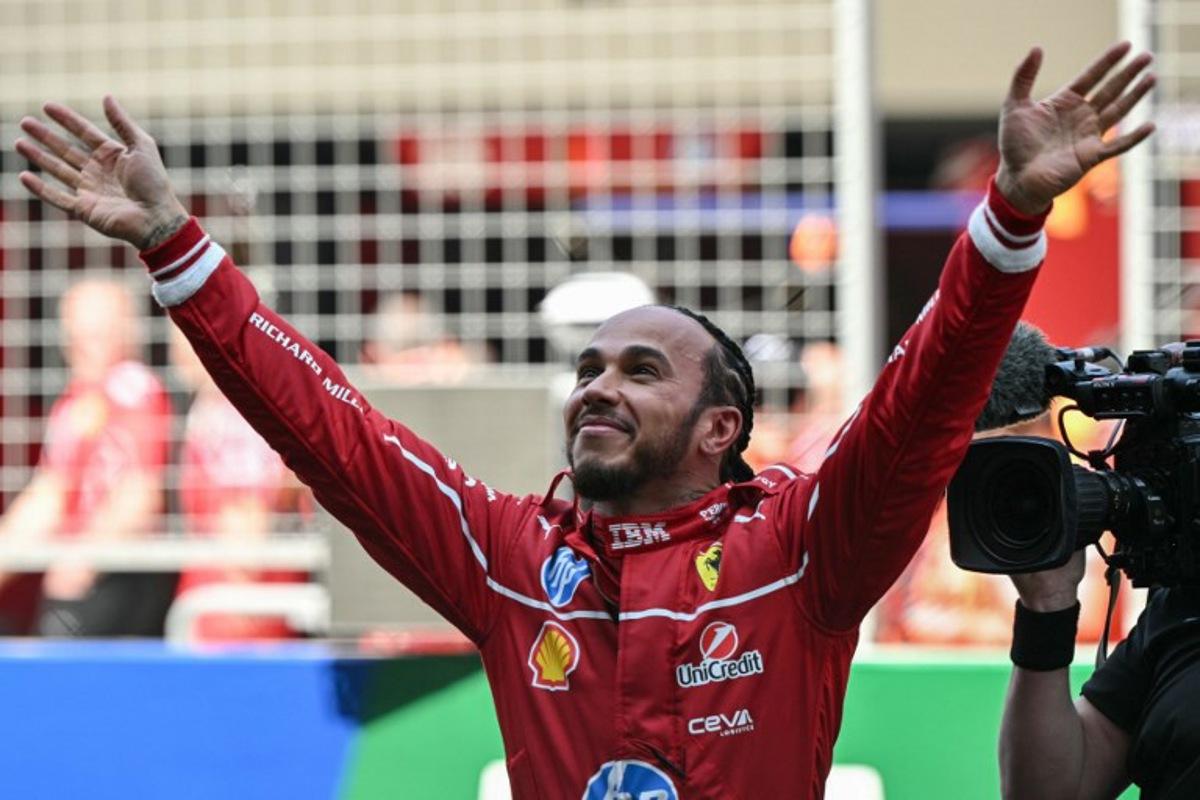 Ferrari's British driver Lewis Hamilton celebrates winning the sprint race of the Formula One Chinese Grand Prix at the Shanghai International Circuit in Shanghai on March 22, 2025.  Greg Baker / AFP