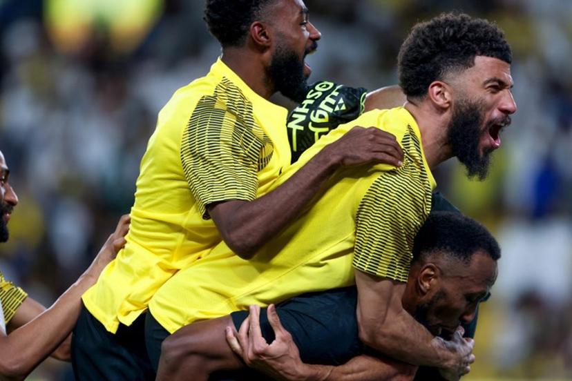 Ittihad's players celebrate their victory during the Saudi Pro League football match between Al-Nassr and Al-Ittihad at Al-Awwal Park in Riyadh on May 7, 2025.  Fayez NURELDINE / AFP