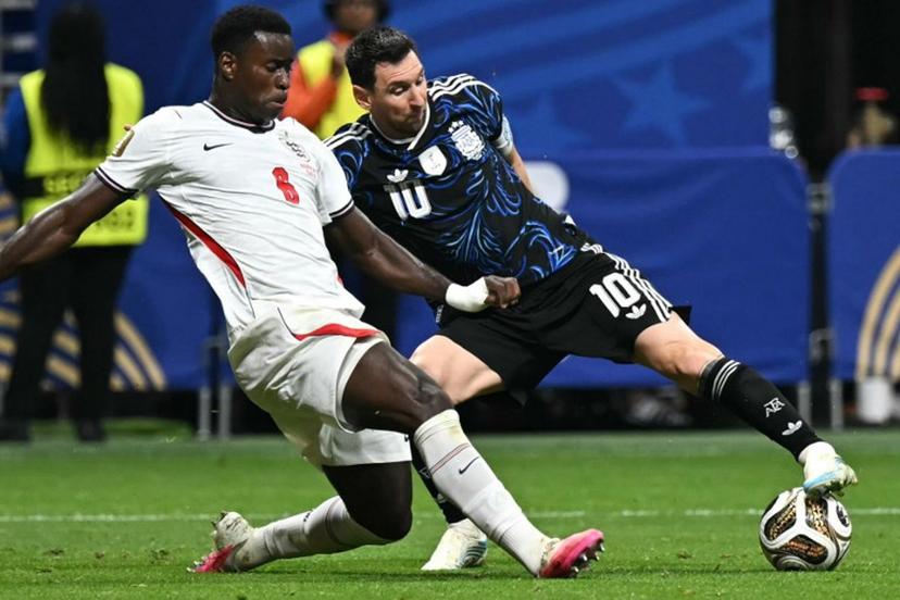 England's defender #06 Marc Guehi (L) and Argentina's forward #10 Lionel Messi fight for the ball during the 2026 World Cup football tournament semi-final match between England and Argentina at the Atlanta Stadium in Atlanta on July 15, 2026.   Paul ELLIS / AFP