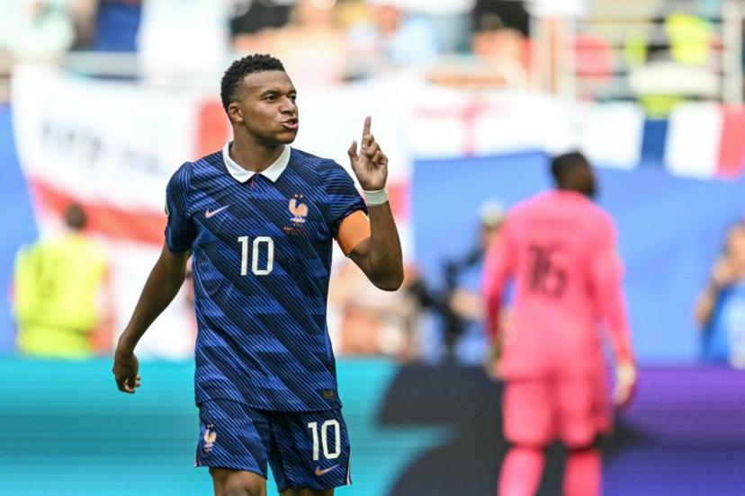 France's forward #10 Kylian Mbappe celebrates scoring his team's third goal during the 2026 World Cup football tournament third-place match between France and England at the Miami Stadium in Miami on July 18, 2026.   CHANDAN KHANNA / AFP