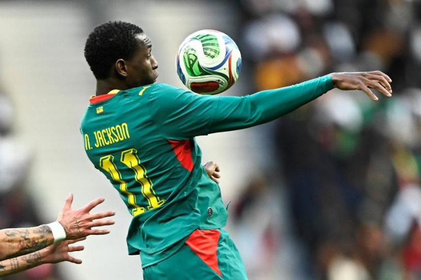 Senegal's forward #11 Nicolas Jackson jumps to control the ball during the international friendly football match between Senegal and Peru at the Stade de France in Saint-Denis, north of Paris, on March 28, 2026.   JULIEN DE ROSA / AFP