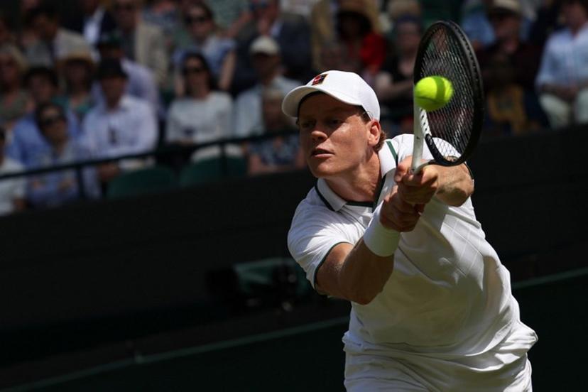 Italy's Jannik Sinner returns to US player Jenson Brooksby during their men's singles third round tennis match on the fifth day of the 2026 Wimbledon Championships at The All England Lawn Tennis and Croquet Club in Wimbledon, southwest London, on July 3, 2026.  Adrian Dennis / AFP