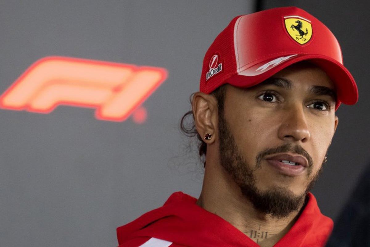 Ferrari's British driver Lewis Hamilton talks to the media in the paddock ahead of the Formula One Hungarian Grand Prix at the Hungaroring circuit in Mogyorod near Budapest, Hungary, on July 23, 2026.  Andrej ISAKOVIC / AFP