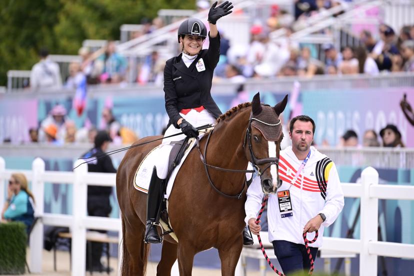 Belgian Barbara Minneci and her horse Stuart and groom Antoine Guillaume pictured at the Individual Freestyle Event Grade III equestrian event, on day 11 of the 2024 Summer Paralympic Games in Paris, France on Saturday 07 September 2024. The 17th Paralympics are taking place from 28 August to 8 September 2024 in Paris. BELGA PHOTO LAURIE DIEFFEMBACQ