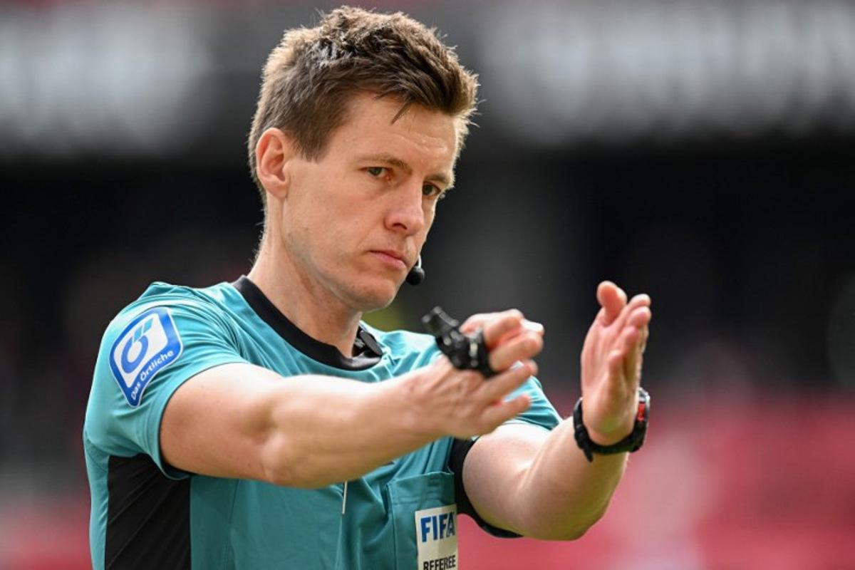 German referee Daniel Siebert reacts during the German first division Bundesliga football match between SC Freiburg and FC Bayern Munich in Freiburg, southern Germany on April 4, 2026.  Silas STEIN / AFP