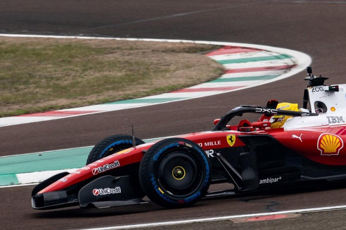 Lewis Hamilton (44) of Great Britain  waves to fans as he steers the new Formula 1 Ferrari SF-26 during tests at Fiorano Circuit in Fiorano Modenese, on January 23, 2026.  Federico SCOPPA / AFP