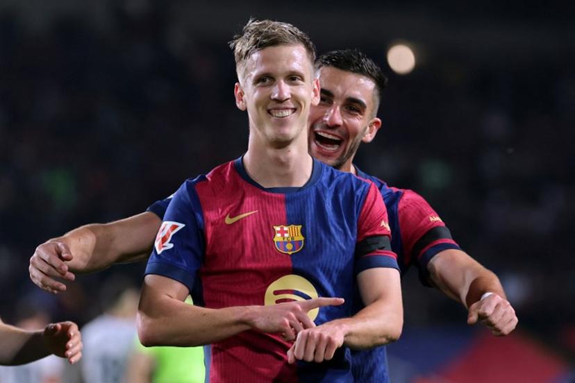 Barcelona's Spanish forward #20 Daniel Olmo (Front) celebrates with his teammate Barcelona's Spanish forward #07 Ferran Torres after scoring a penalty kick and his team's second goal during the Spanish league football match between FC Barcelona and CA Osasuna at Estadi Olimpic Lluis Companys in Barcelona on March 27, 2025.  LLUIS GENE / AFP
