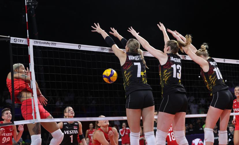 Turkey's Melissa Teresa Vargas, Belgium's Celine Van Gestel, Belgium's Marlies Janssens and Belgium's Pauline Martin fight for the ball during a volleyball game between Turkey and Belgian national women volleyball team Yellow Tigers, Sunday 27 August 2023 in Gent, the 1/8th finals of the 2023 European Women's Championships. The 2023 EuroVolley tournament takes place from August 15 to September 3. BELGA PHOTO VIRGINIE LEFOUR