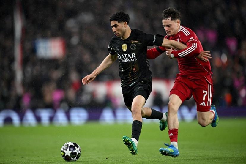 Paris Saint-Germain's Moroccan defender #02 Achraf Hakimi is put under pressure by Liverpool's German midfielder #07 Florian Wirtz during the UEFA Champions League quarter final, second-leg football match between Liverpool and Paris Saint-Germain at Anfield in Liverpool, north west England on April 14, 2026.  Paul ELLIS / AFP