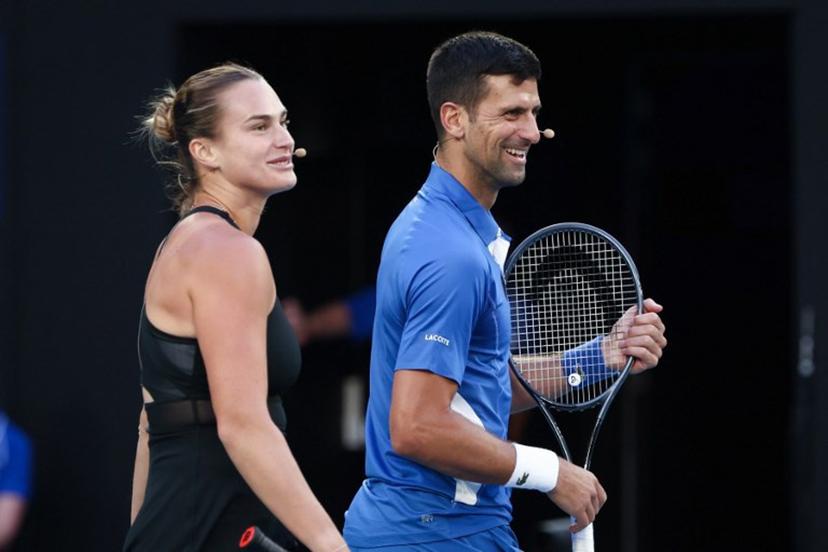Aryna Sabalenka from Belarus and Serbia's Novak Djokovic play mixed-doubles together during a charity event on Rod Laver Arena in Melbourne on January 11, 2024 ahead of the Australian Open tennis championship starting on January 14.  DAVID GRAY / AFP