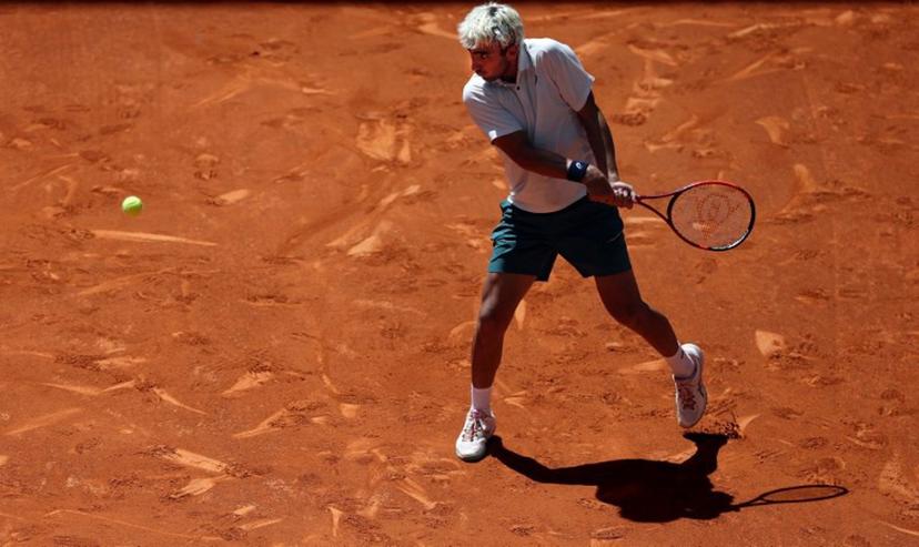 Spain's Daniel Merida returns the ball to Greece's Stefanos Tsitsipas during their 2026 ATP Tour Madrid Open tennis tournament third round singles match at the Caja Magica in Madrid, on April 27, 2026.  Thomas COEX / AFP