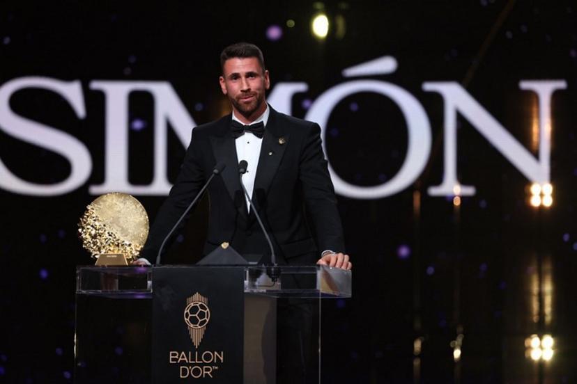 Spain's goalkeeper Unai Simon speaks after receiving the Yashin Trophy for the best male goalkeeper during the 2026 Ballon d'Or France Football award ceremony at the Palladium Theatre in London on October 26, 2026.  FRANCK FIFE / AFP