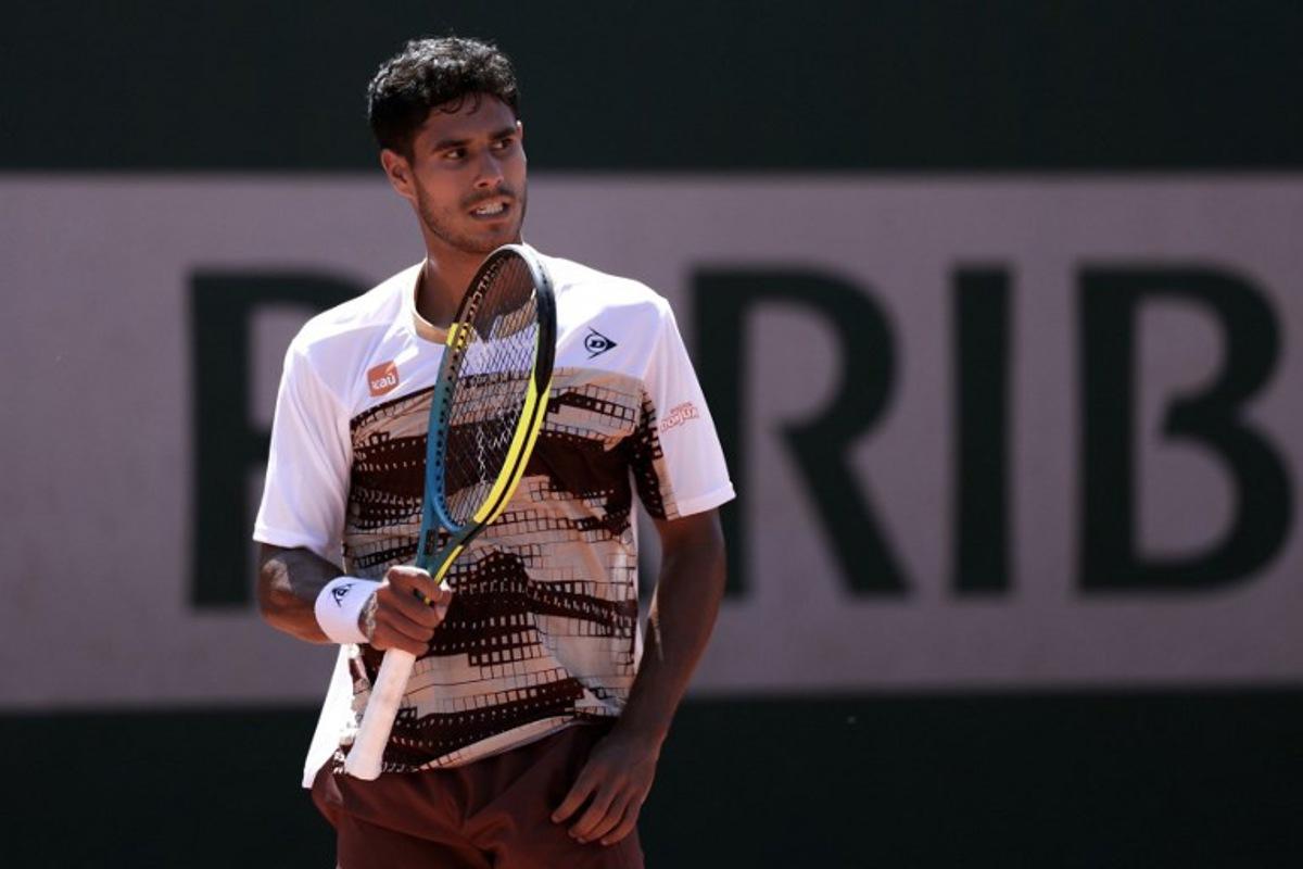 Paraguay's Adolfo Daniel Vallejo reacts after a point as he plays against Great Britain's Cameron Norrie during their men's singles match on day 3 of the French Open tennis tournament at the Roland-Garros Complex in Paris on May 26, 2026.  Alain JOCARD / AFP