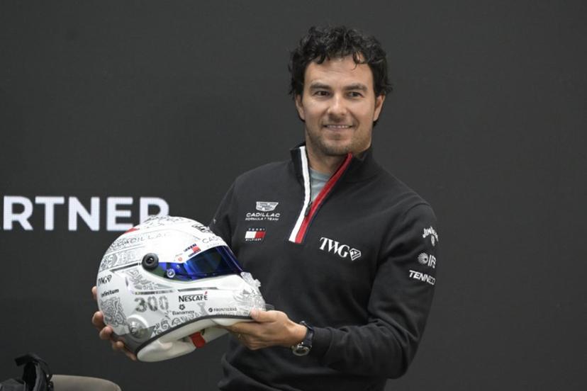 Mexican F1 driver Sergio Perez of Cadillac Team shows his helmet during a press conference in Mexico City, on October 27, 2026, ahead of the upcoming Mexico GP.  Alfredo ESTRELLA / AFP