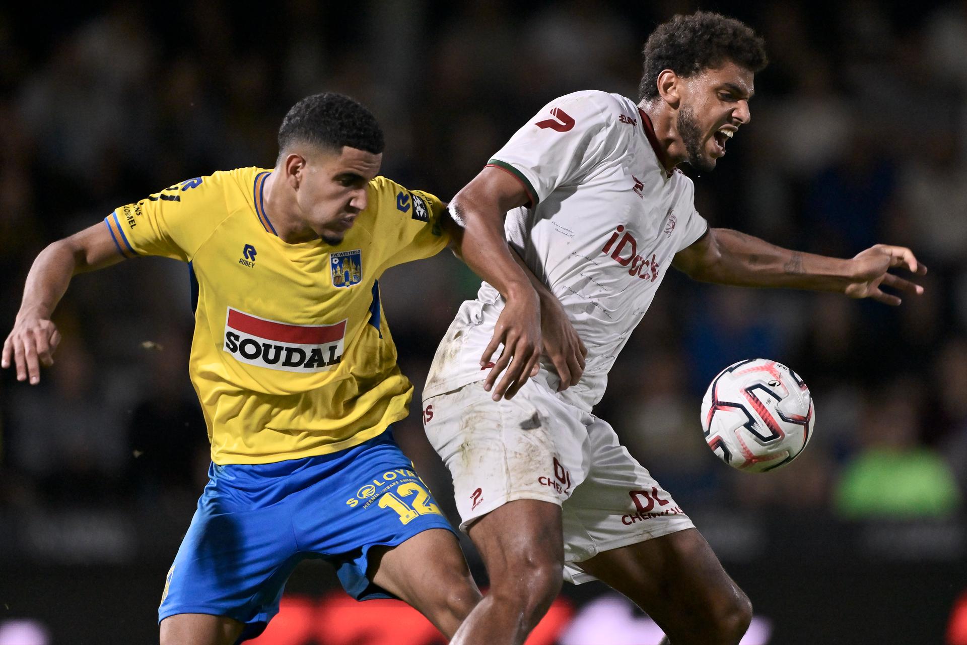 Westerlo's Reda Laalaoui and Essevee's Anosike Ementa fight for the ball during a soccer match between KVC Westerlo and Zulte Waregem, Sunday 30 August 2026 in Westerlo, on day 4 of the 2026-2027 'Jupiler Pro League' first division of the Belgian championship. BELGA PHOTO JOHAN EYCKENS