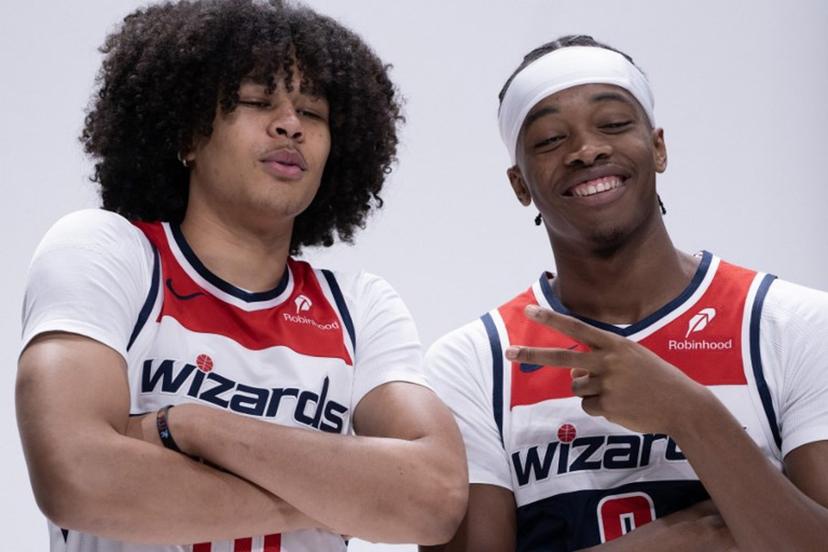 Bilal Coulibaly (R), French basketball player for the Washington Wizards, jokes around with Swiss teammate Kyshawn George at Wizards media day ahead of the NBA season at Capital One Arena in Washington, DC, September 30, 2024.  ROBERTO SCHMIDT / AFP