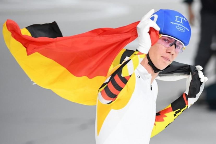 Belgium's Bart Swings celebrates his silver medal win in the men's mass start final speed skating event during the Pyeongchang 2018 Winter Olympic Games at the Gangneung Oval in Gangneung on February 24, 2018.  Roberto SCHMIDT / AFP