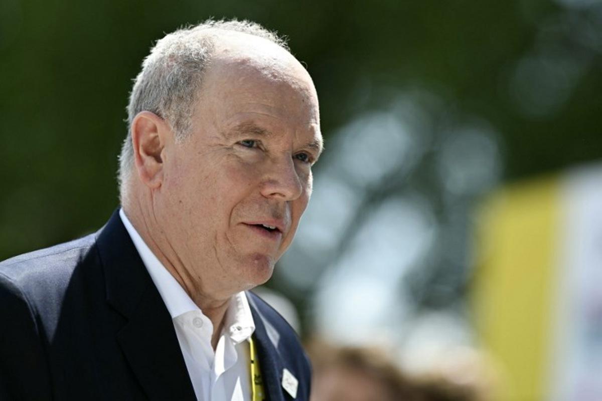Prince Albert II of Monaco looks on as he awaits the start of the 13th stage of the 113th edition of the Tour de France cycling race, 205,8 km between Dole and Belfort in eastern France, on July 17, 2026.  Loic VENANCE / AFP