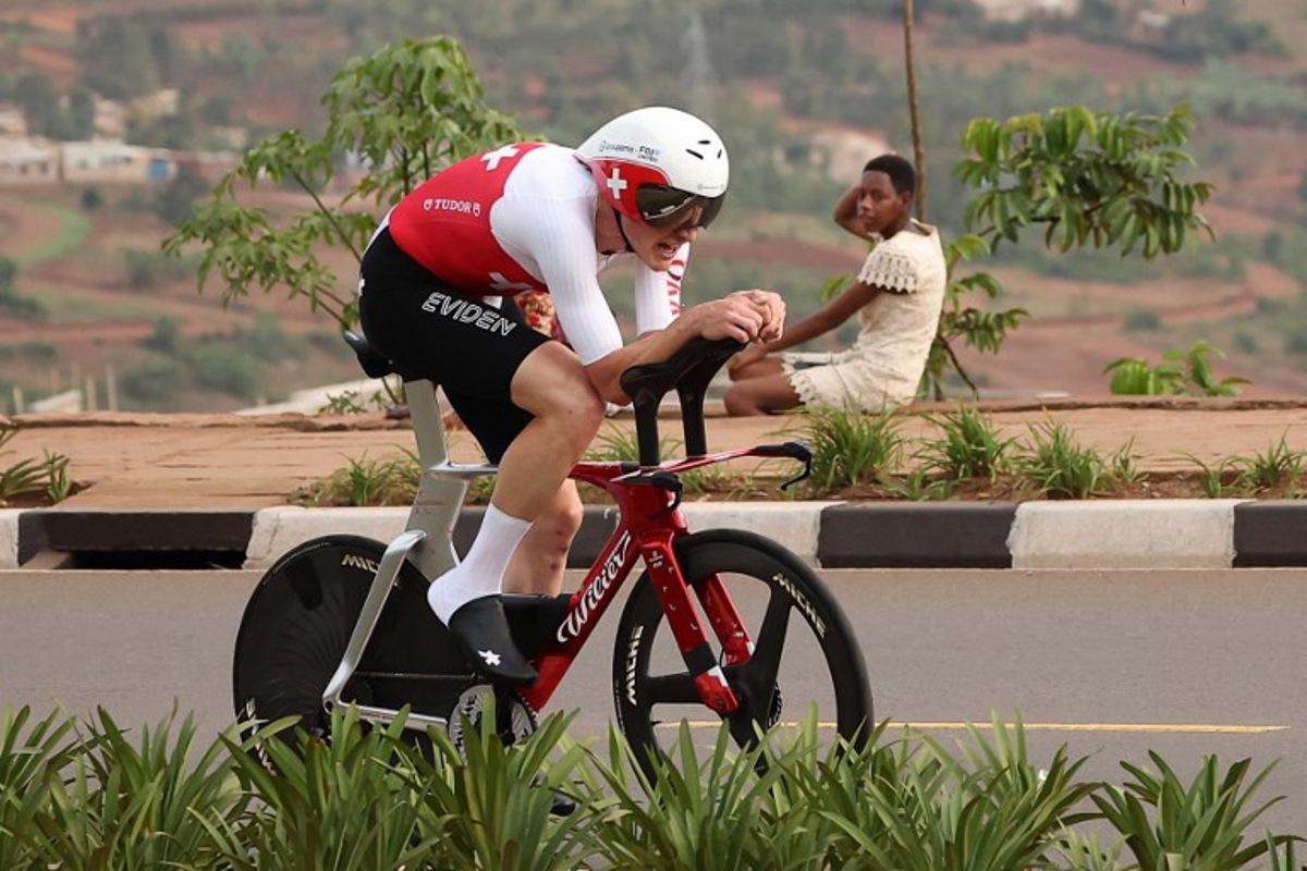 Swiss rider Stefan Kung competes in the men's Elite Individual Time Trial cycling event during the UCI 2025 Road World Championships, in Kigali, on September 21, 2025.  Anne-Christine POUJOULAT / AFP
