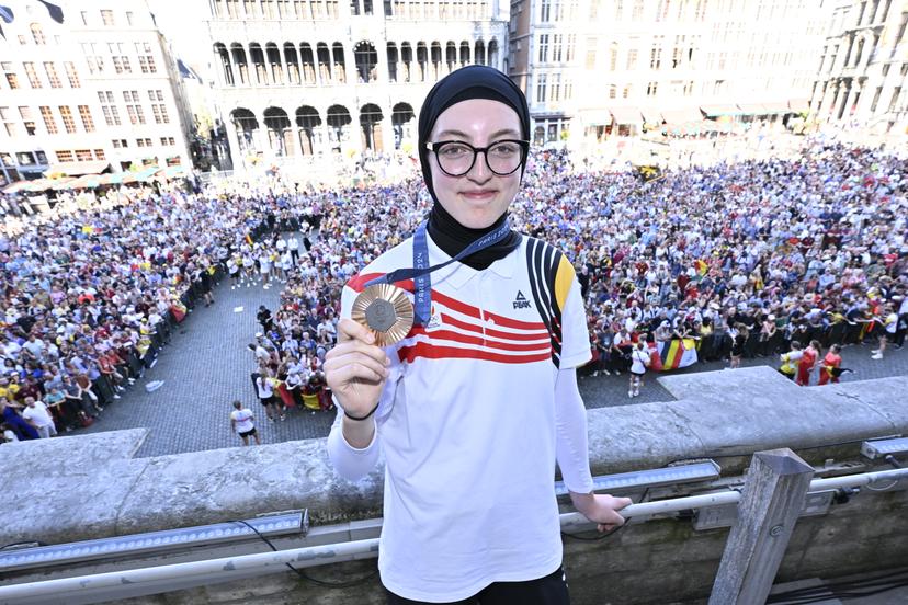 Belgian taekwondoka Sarah Chaari poses with her bronze medal at celebrations after the Paris 2024 Olympic Games, at the Grand Place - Grote Markt and the Brussels City Hall, in Brussels, on Monday 12 August 2024. The Belgian delegation at the Games of the XXXIII Olympiad counted 165 athletes competing in 21 sports. BELGA PHOTO ERIC LALMAND