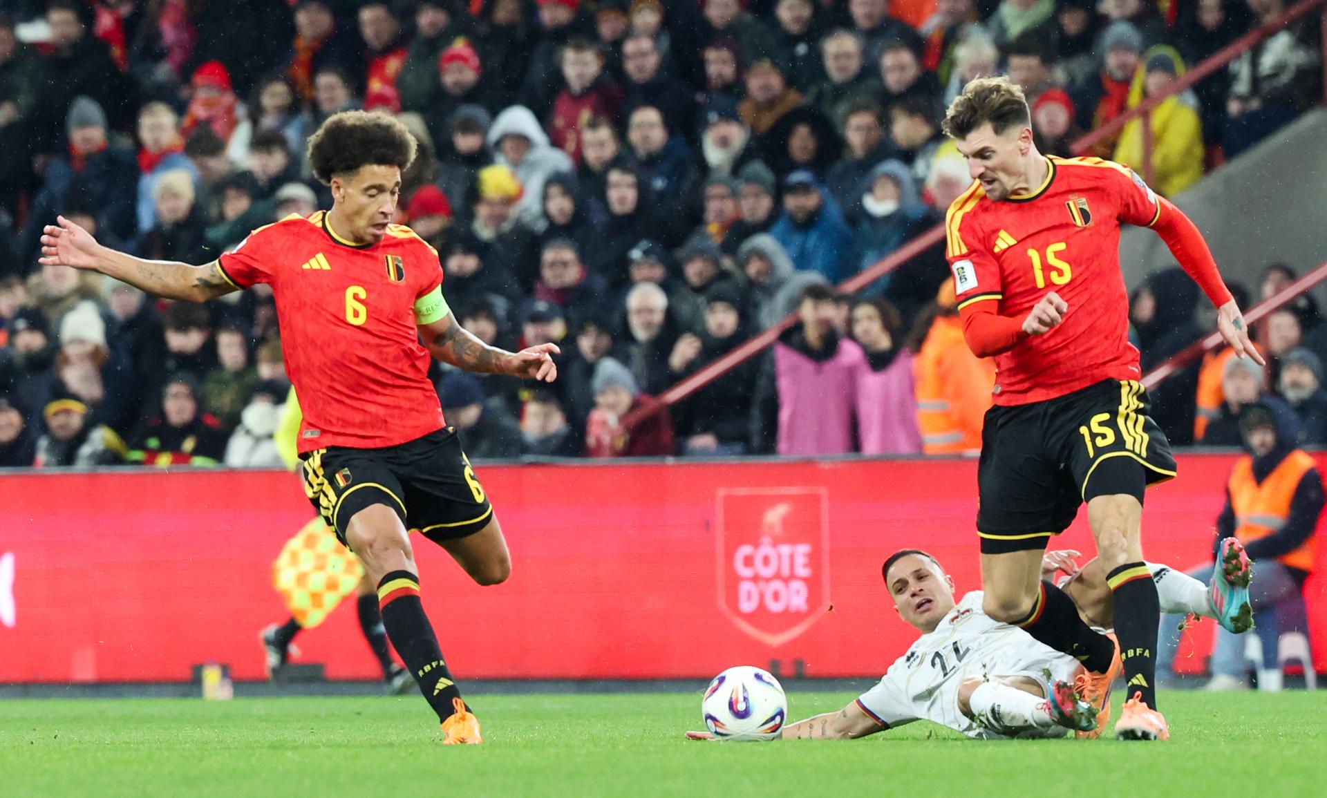 Belgium's Thomas Meunier and Liechtenstein's Villiam Pizzi fight for the ball during a soccer game between Belgium's Red Devils and Liechtenstein, the last FIFA World Cup 2026 qualification match, in Liege on Tuesday 18 November 2025. BELGA PHOTO VIRGINIE LEFOUR