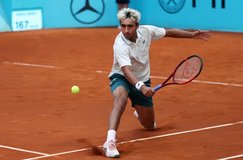Spain's Daniel Merida returns the ball to France's Corentin Moutet during their 2026 ATP Tour Madrid Open tennis tournament third round singles match at the Caja Magica in Madrid, on April 25, 2026.   Thomas COEX / AFP