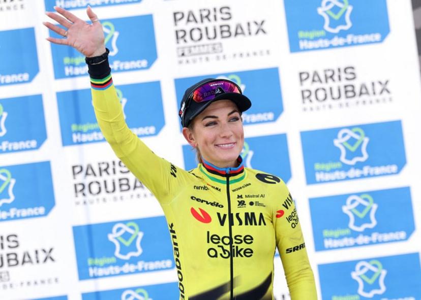 Third-placed Team Visma - Lease a Bike's French rider Pauline Ferrand-Prévot celebrates on the podium of the 6th edition of the Women Paris-Roubaix one-day classic cycling race, 143.1 km between Denain and Roubaix, at the Vélodrome André-Pétrieux in Roubaix, northern France, on April 12, 2026.  Francois LO PRESTI / AFP