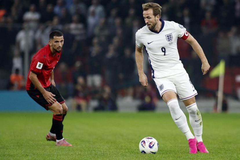 England's striker #09 Harry Kane controls the ball in front of Albania's defender #17 Naser Aliji during the FIFA World Cup 2026 European qualification football match between Albania and England at the Air Albania stadium in Tirana, on November 16, 2025.   Adnan Beci / AFP