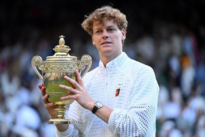 Italy's Jannik Sinner poses with his trophy after beating Germany's Alexander Zverev during their men's singles final tennis match on the fourteenth day of the 2026 Wimbledon Championships at The All England Lawn Tennis and Croquet Club in Wimbledon, southwest London, on July 12, 2026.  Kirill KUDRYAVTSEV / AFP