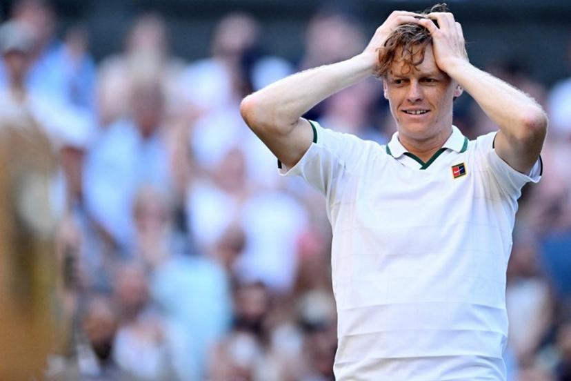 Italy's Jannik Sinner reacts to beating Germany's Alexander Zverev (R) for winning their men's singles final tennis match on the fourteenth day of the 2026 Wimbledon Championships at The All England Lawn Tennis and Croquet Club in Wimbledon, southwest London, on July 12, 2026.  Kirill KUDRYAVTSEV / AFP